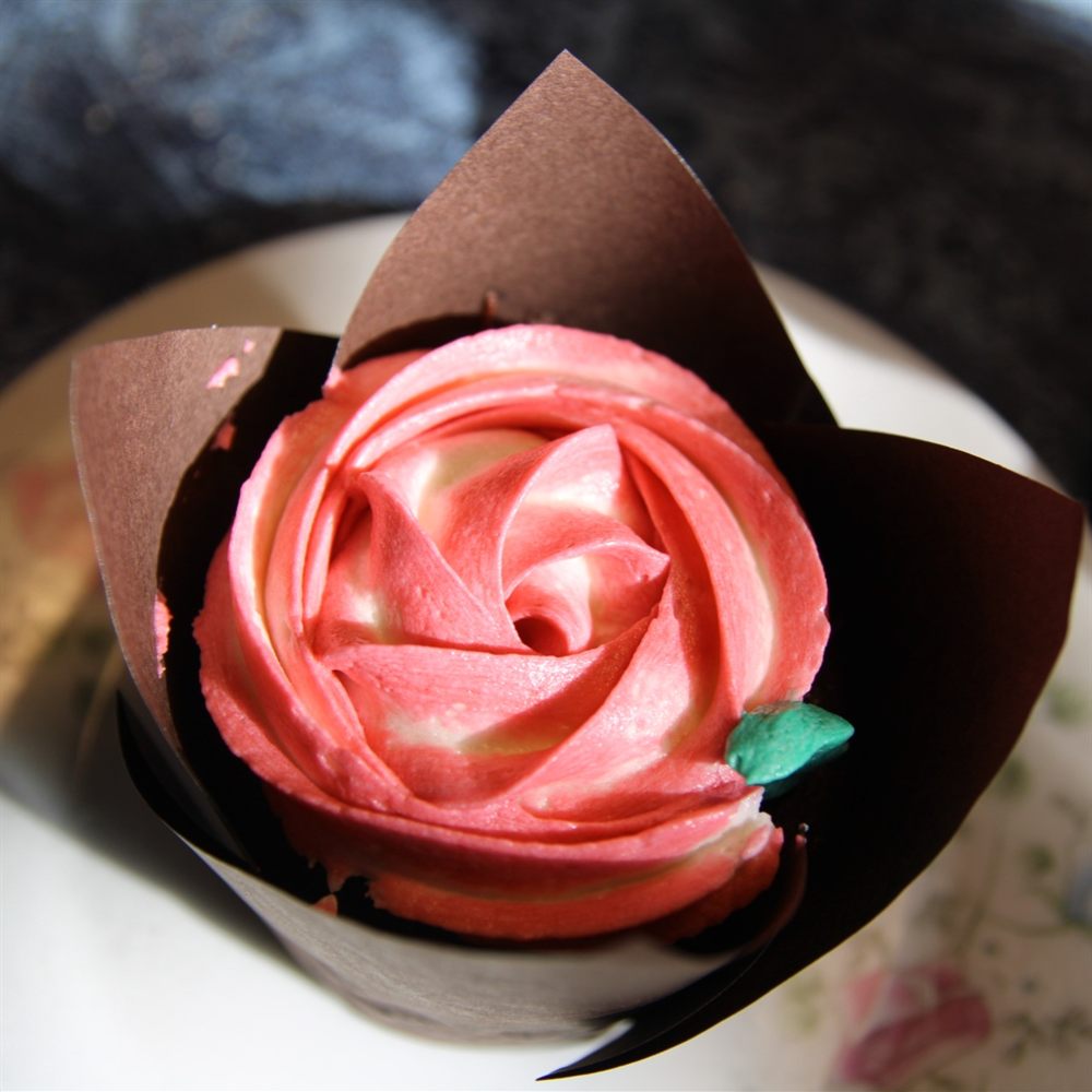 Rose matcha cupcake close-up showing detailed frosting