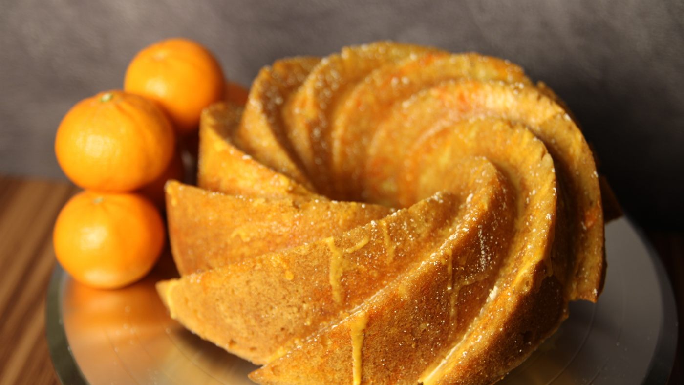 Tangerine Dream Bundt Cake photographed with citrus garnish